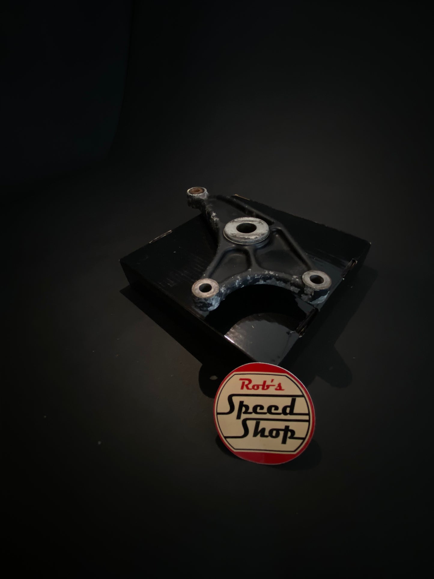 RG500 / RG400 rear caliper, hangar, and torque rod.