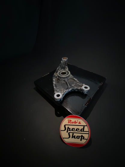 RG500 / RG400 rear caliper, hangar, and torque rod.