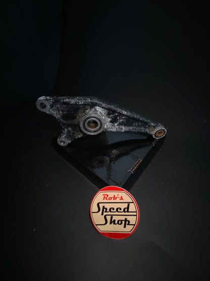 RG500 / RG400 rear caliper, hangar, and torque rod.
