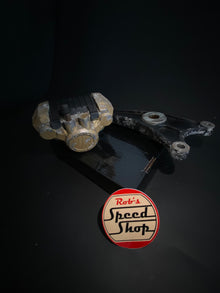 RG500 / RG400 rear caliper, hangar, and torque rod.